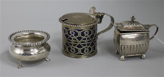 A Victorian silver mustard pot, a later silver mustard pot and a silver salt.